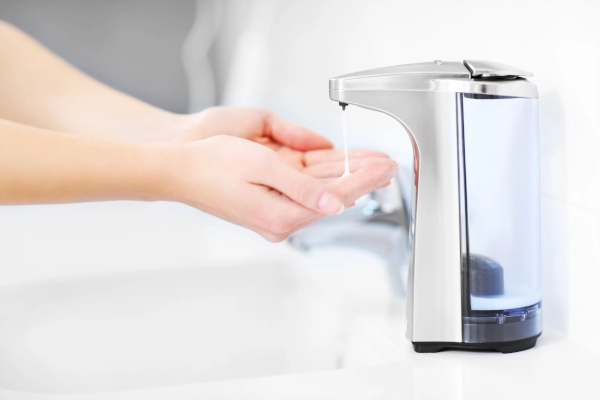 Person using a touchless soap dispenser