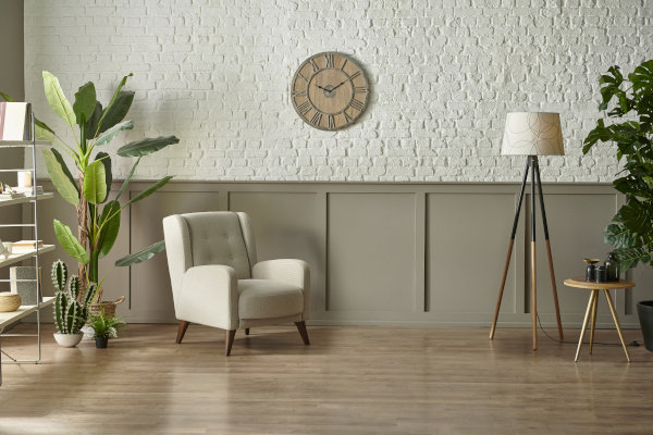 Living room with wooden clock on the wall